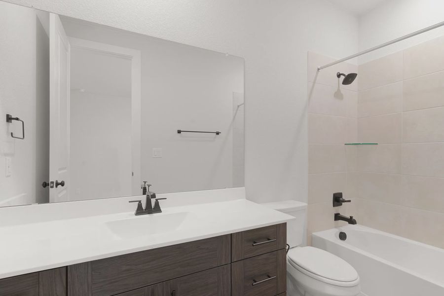 Representative furnished interior of a home built from the Barron by Chesmar Homes in Lariat, Liberty Hill (Image 11).