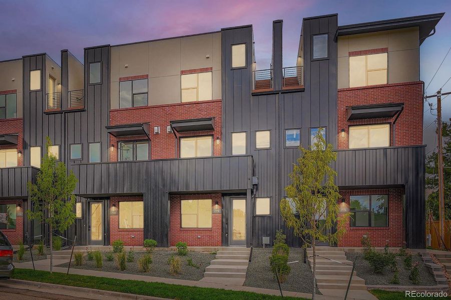 Front exterior of a new home in Applewood Village, Lakewood, CO, highlighting curb appeal (Image 1).
