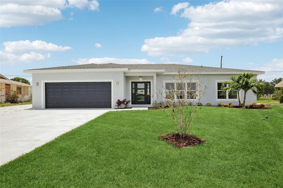 Front exterior of a new home in , Sun City Center, FL, highlighting curb appeal (Image 1).