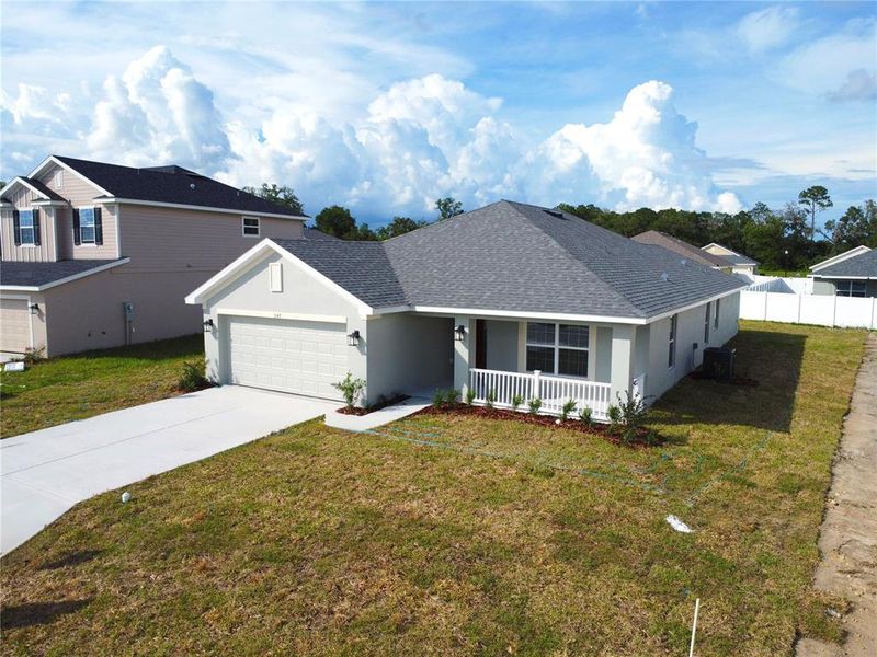 Front exterior of a new home in , Ocala, FL, highlighting curb appeal (Image 2). Front exterior of a new home in , Ocala, FL, highlighting curb appeal (Image 2).