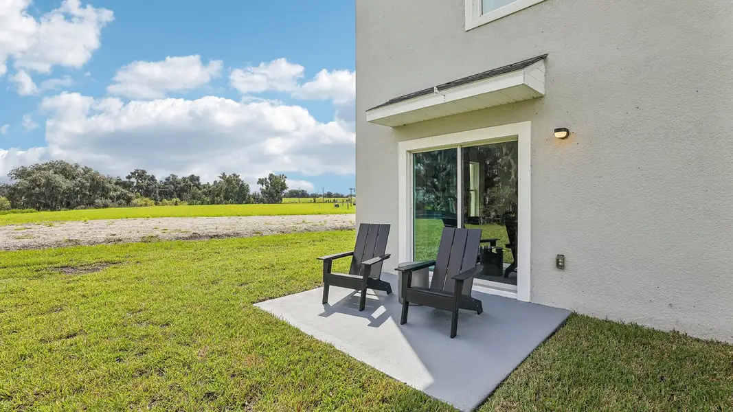 Exterior details and patio area of a home in Farm at Varrea, Plant City (Image 2).