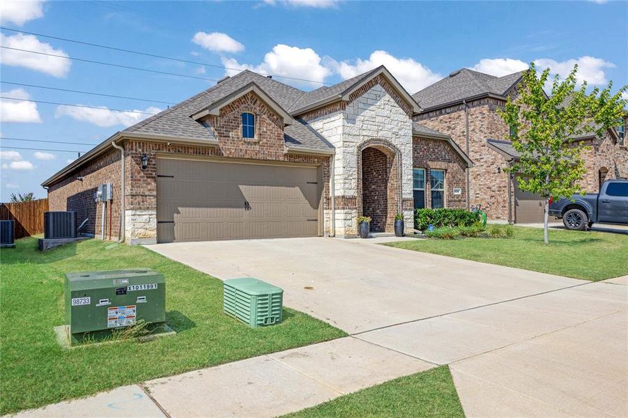 Front exterior of a new home in , Aubrey, TX, highlighting curb appeal (Image 18).