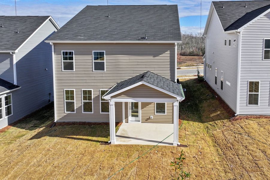 Exterior details and patio area of a home in Renaissance at White Oak, Garner (Image 21).