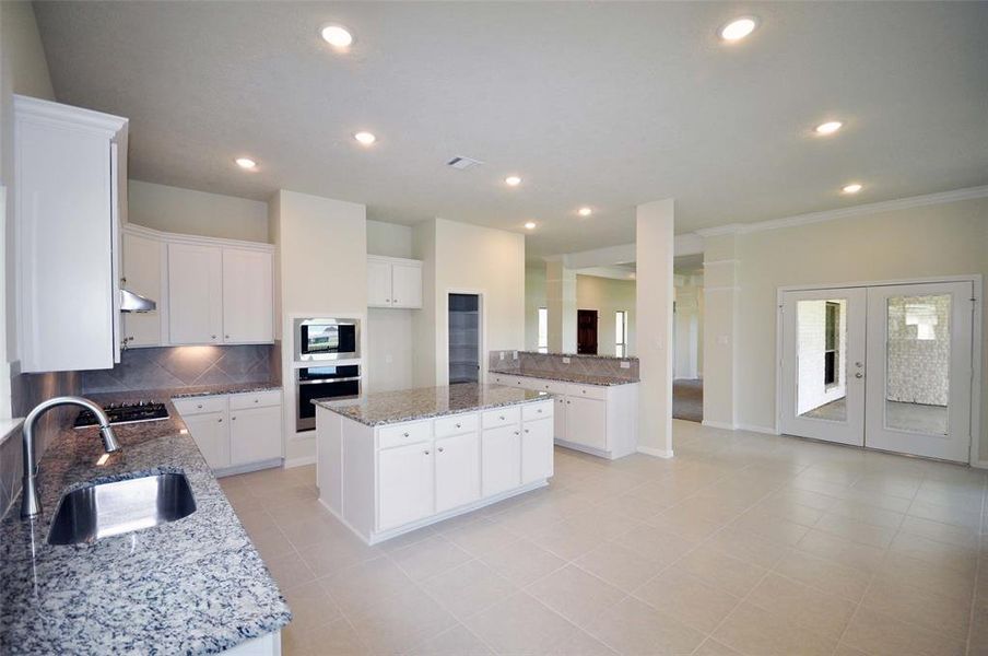 LED lighting surface mounts in the ceiling and LED lights under cabinets are standard at Cervelle Homes in Pedregal.