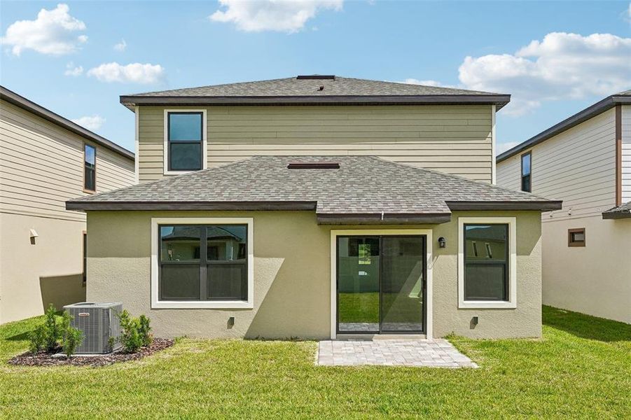 Exterior details and patio area of a home in Grasslands West, Lakeland (Image 3).