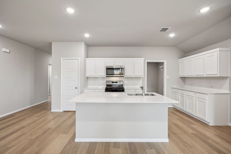 Kitchen in the Sabrina home plan by Trophy Signature Homes – REPRESENTATIVE PHOTO