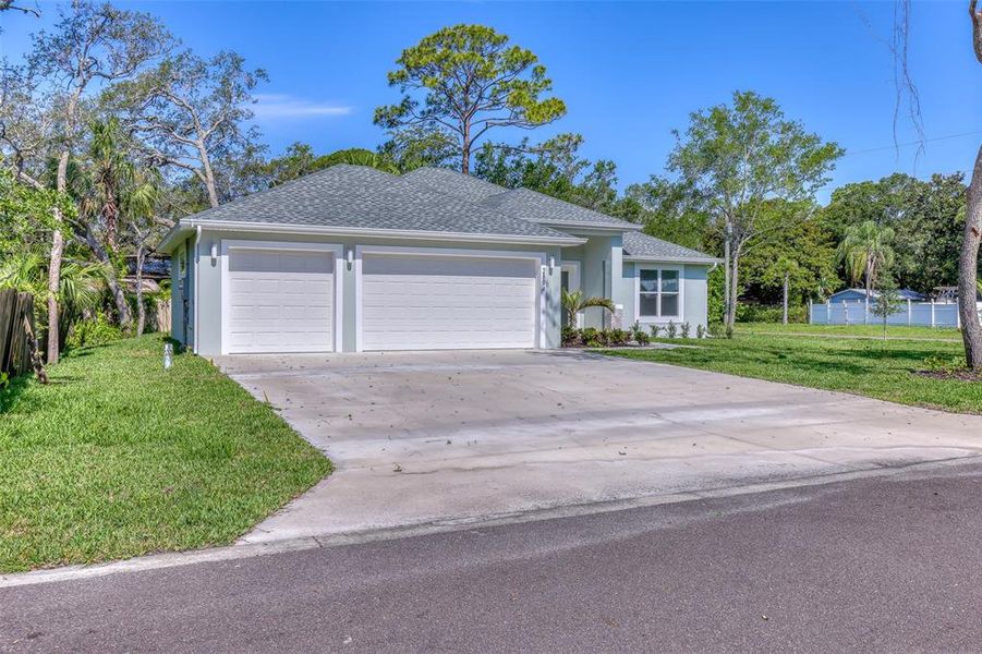 Front exterior of a new home in , New Smyrna Beach, FL, highlighting curb appeal (Image 27).