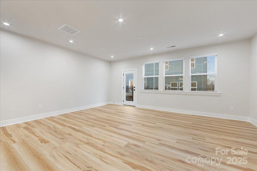 Great Room Wrapped in Durable and Easy to Maintain Flooring.