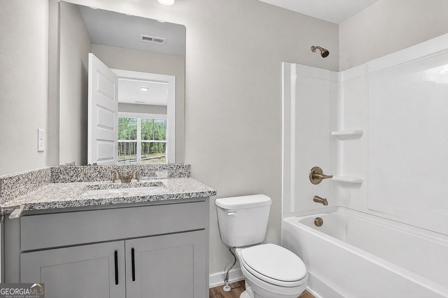 Furnished interior view inside a new home in The Fairways at Mirror Lake, Villa Rica (Image 9).