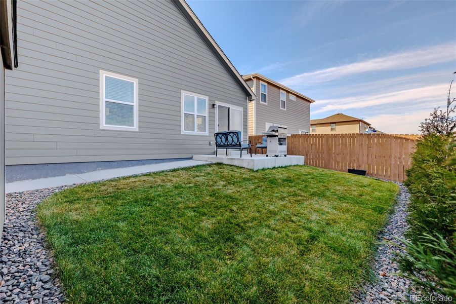 Fully landscaped with concrete patio, walkway, sod, rock, privacy trees and 6' privacy fence Fully landscaped with concrete patio, walkway, sod, rock, privacy trees and 6' privacy fence