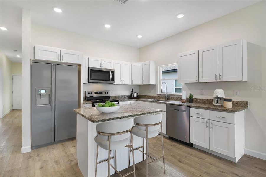 KITCHEN. Virtually Staged/Fridge is virtually staged.