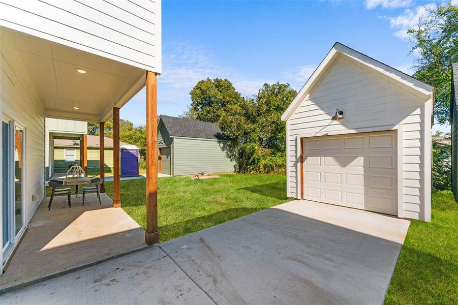Detached garage featuring driveway