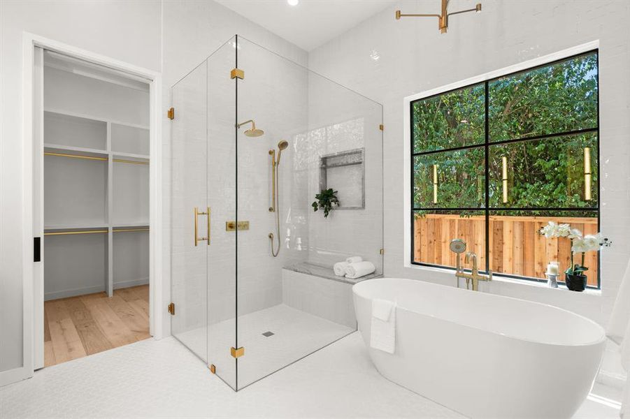 Spa-like bath with soaking tub and calming finishes.