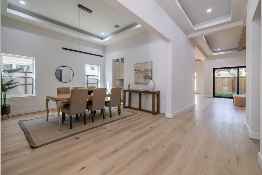 Dining space with designer wall detail and an elegant setting suited for both intimate dinners and entertaining.