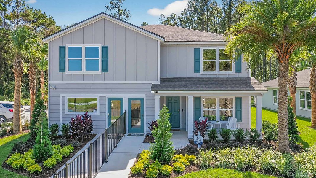 Front exterior of a new home in Copes Landing, Jacksonville, FL, highlighting curb appeal (Image 2). Front exterior of a new home in Copes Landing, Jacksonville, FL, highlighting curb appeal (Image 2).
