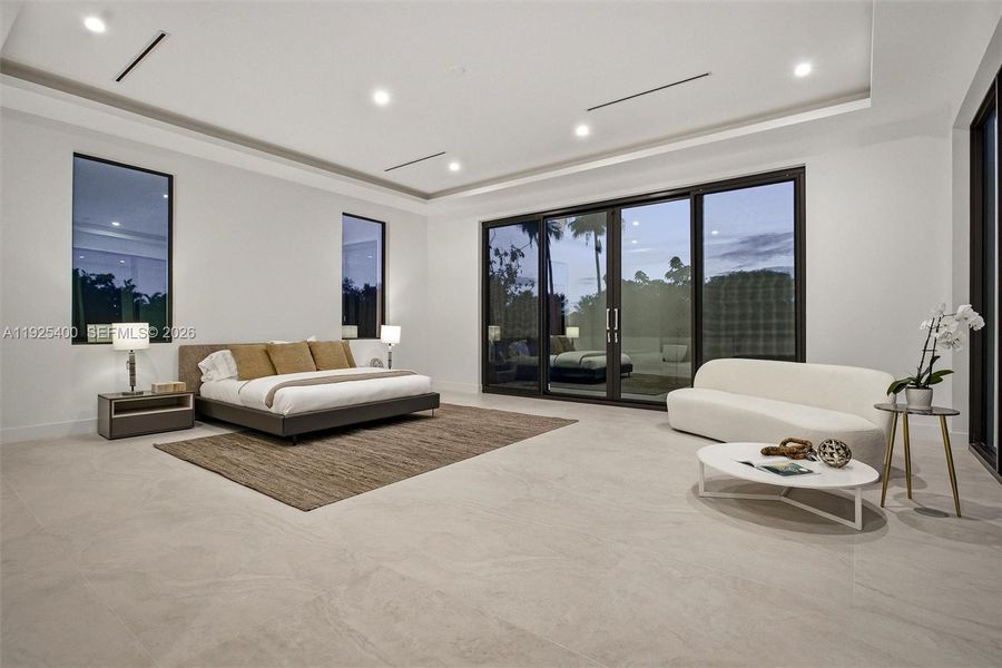 Primary Suite | Tray Ceiling | Private Balcony | Floor-to-Ceiling Sliders | Pinecrest FL Primary Suite | Tray Ceiling | Private Balcony | Floor-to-Ceiling Sliders | Pinecrest FL