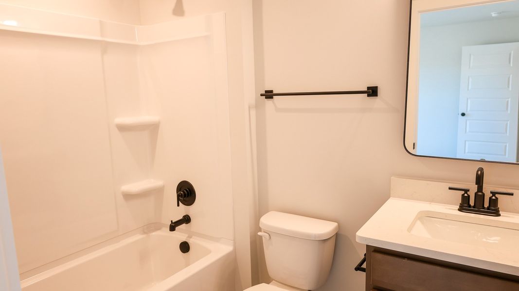 Representative furnished interior of a home built from the TISDALE by D.R. Horton in Harvest Point, Spring Hill (Image 15).