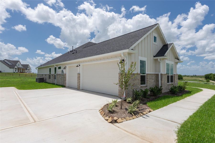 Spacious three-car garage, and attractive landscaping. Spacious three-car garage, and attractive landscaping.