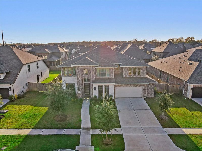 Front exterior of a new home in Fulbrook On Fulshear Creek 60', Fulshear, TX, highlighting curb appeal (Image 23). Front exterior of a new home in Fulbrook On Fulshear Creek 60', Fulshear, TX, highlighting curb appeal (Image 23).