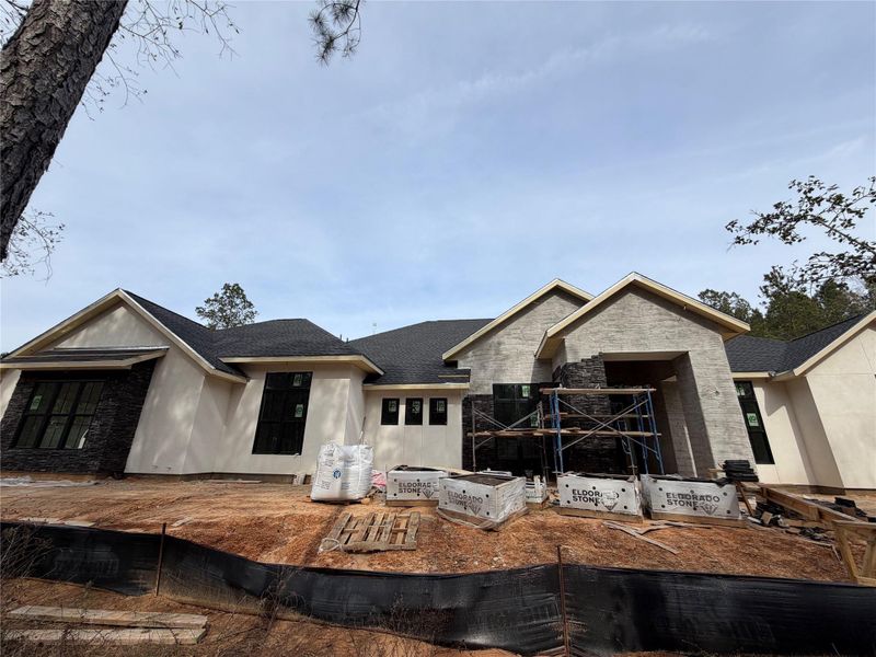 What a view from family room to large covered patio and wooded acreage