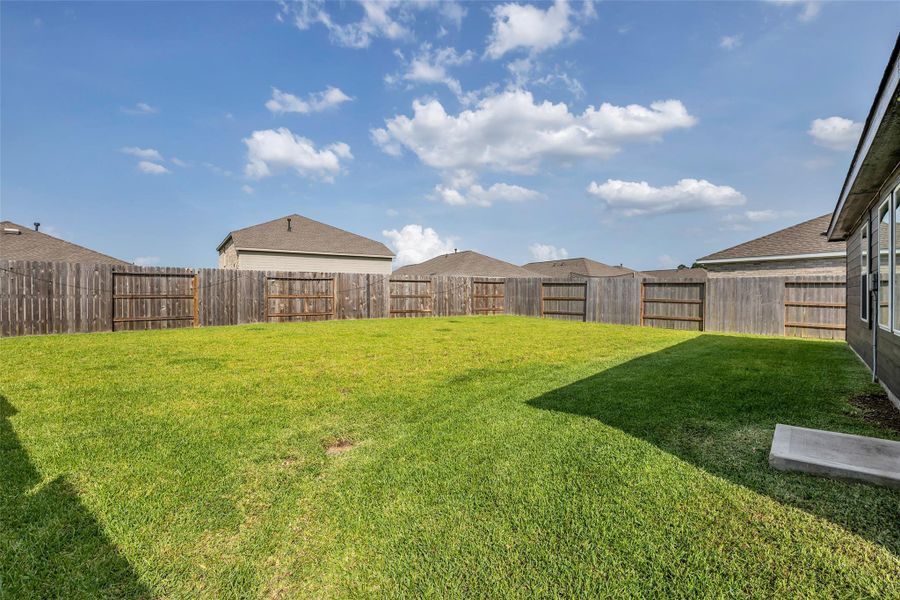 Exterior details and patio area of a home in Tavola, New Caney (Image 23).
