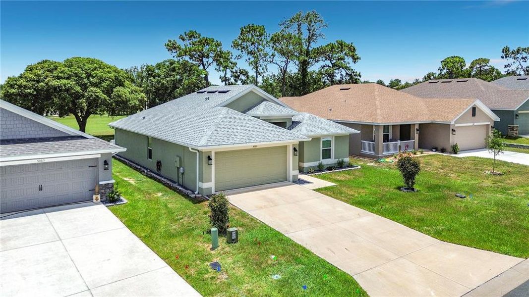 Front exterior of a new home in Twisted Oaks, Beverly Hills, FL, highlighting curb appeal (Image 23). Front exterior of a new home in Twisted Oaks, Beverly Hills, FL, highlighting curb appeal (Image 23).