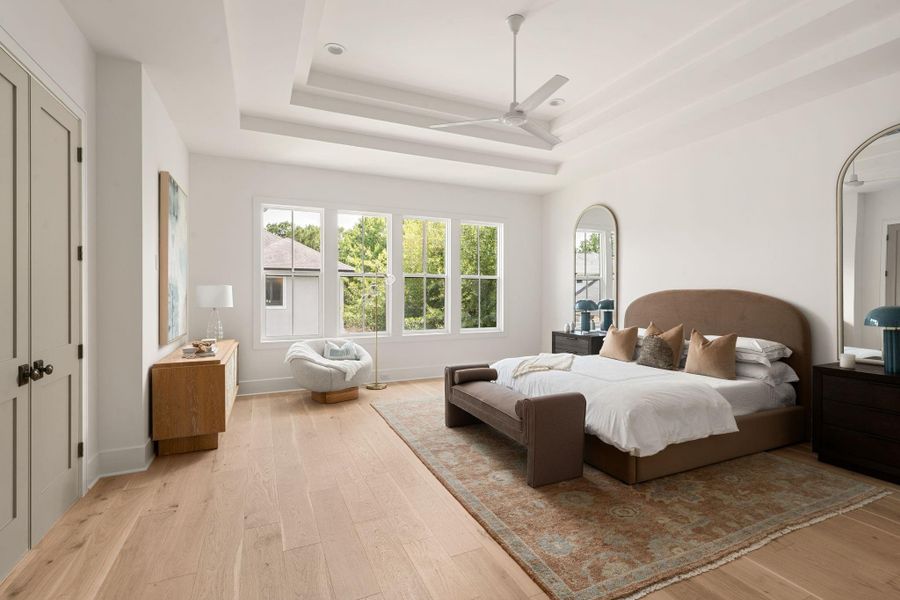 Primary suite is generously sized with elegant ceiling detail.