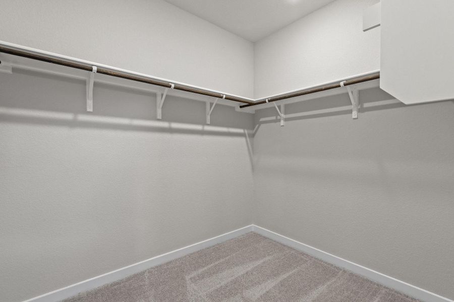 Walk-in closet in Primary Bedroom Walk-in closet in Primary Bedroom