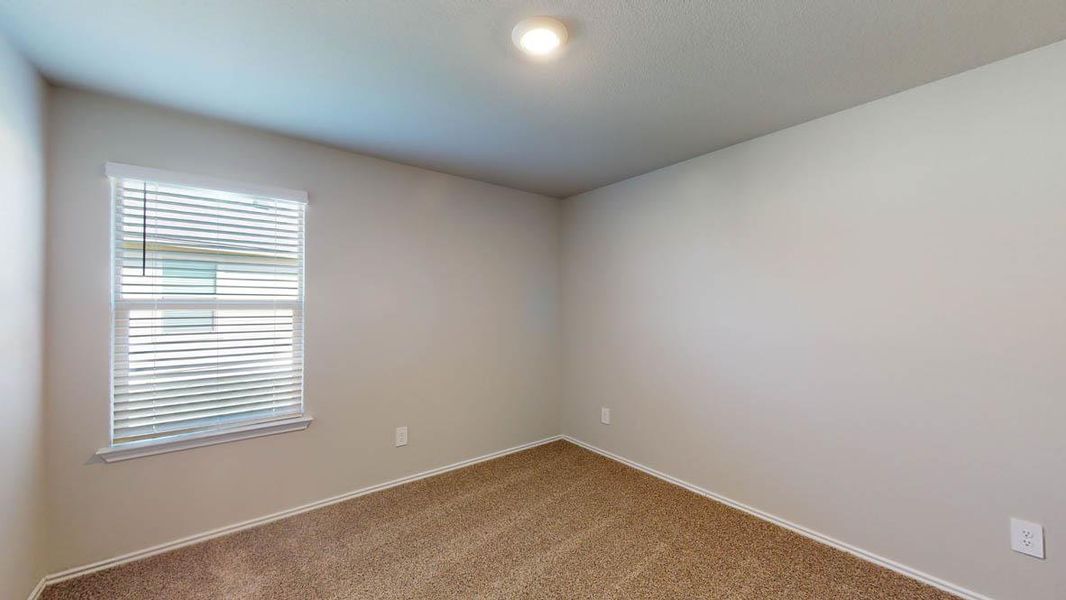 Unfurnished room with carpet and baseboards