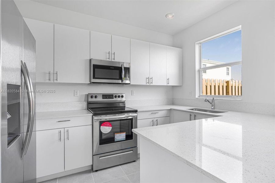 Furnished interior view inside a new home in Cedar Pointe: Cypress Collection, Homestead (Image 13). Furnished interior view inside a new home in Cedar Pointe: Cypress Collection, Homestead (Image 13).