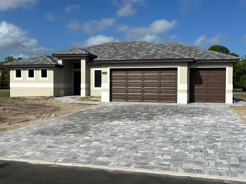 Front exterior of a new home in , Punta Gorda, FL, highlighting curb appeal (Image 1). Front exterior of a new home in , Punta Gorda, FL, highlighting curb appeal (Image 1).