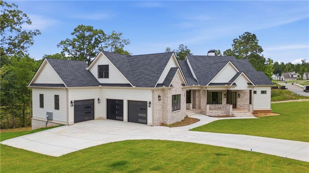 Front exterior of a new home in , Newnan, GA, highlighting curb appeal (Image 28). Front exterior of a new home in , Newnan, GA, highlighting curb appeal (Image 28).