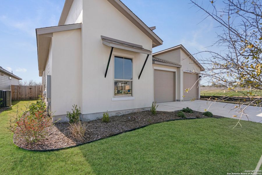 Front exterior of a new home in Nolte Farms, Seguin, TX, highlighting curb appeal (Image 20). Front exterior of a new home in Nolte Farms, Seguin, TX, highlighting curb appeal (Image 20).