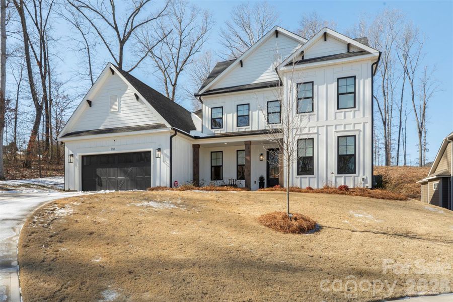 Front exterior of a new home in Red Hill, Concord, NC, highlighting curb appeal (Image 2). Front exterior of a new home in Red Hill, Concord, NC, highlighting curb appeal (Image 2).