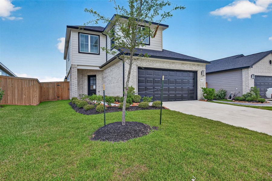 Front exterior of a new home in La Segarra, Brookshire, TX, highlighting curb appeal (Image 1). Front exterior of a new home in La Segarra, Brookshire, TX, highlighting curb appeal (Image 1).