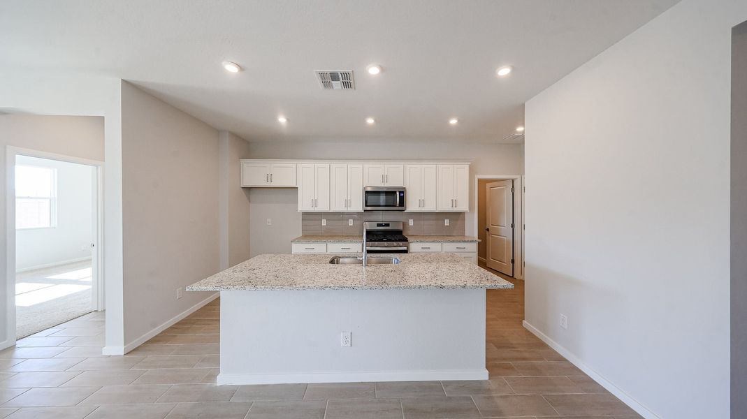 A kitchen with white cabinets. A kitchen with white cabinets.