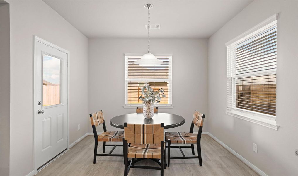 Sun-lit dining area (*Photo not of actual home and used for illustration purposes only.)