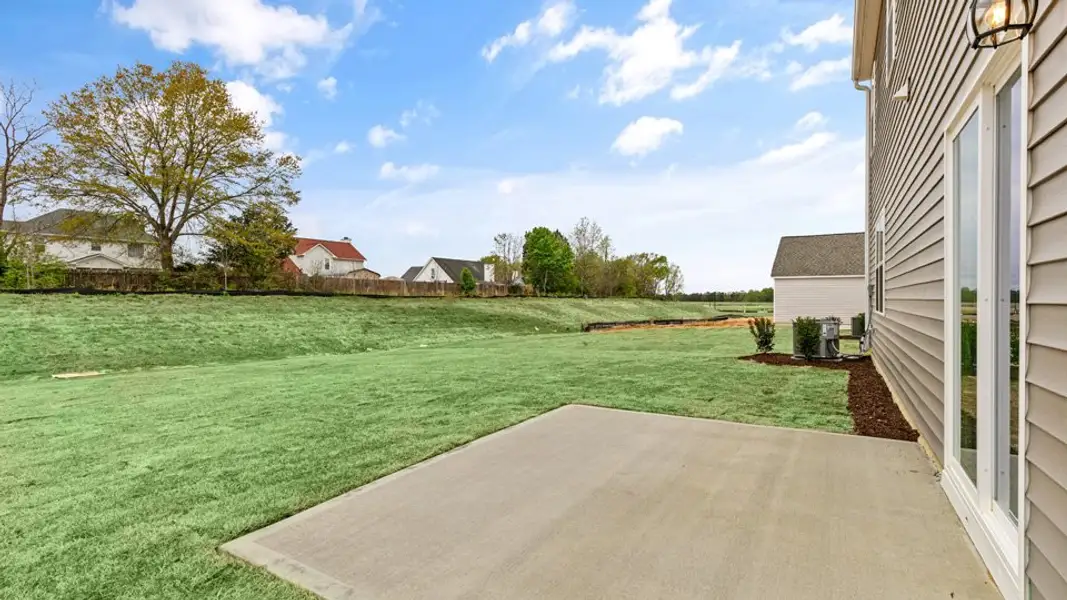 Exterior details and patio area of a home in Honeycutt Oaks, Angier (Image 3).