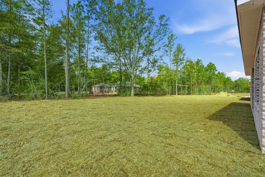 Exterior details and patio area of a home in Southern Charm, Crestview (Image 24).
