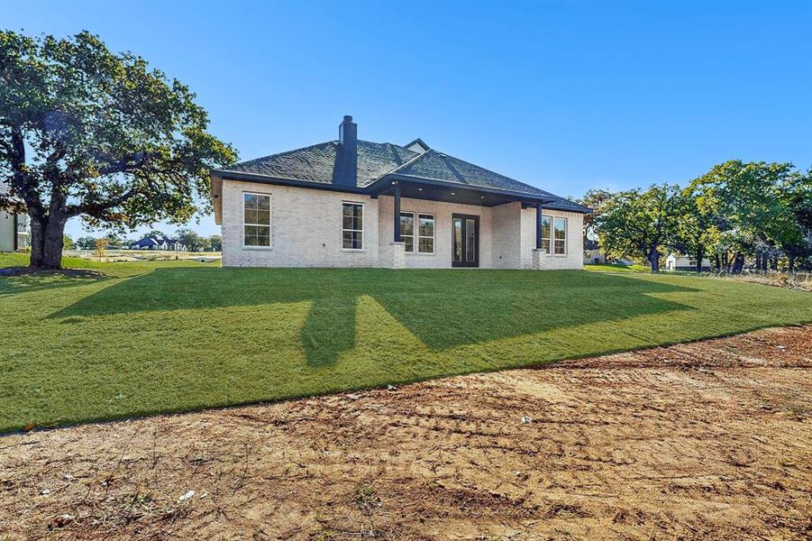 Exterior details and patio area of a home in , Springtown (Image 3).
