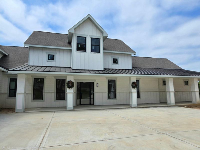 Front exterior of a new home in , Montgomery, TX, highlighting curb appeal (Image 22). Front exterior of a new home in , Montgomery, TX, highlighting curb appeal (Image 22).