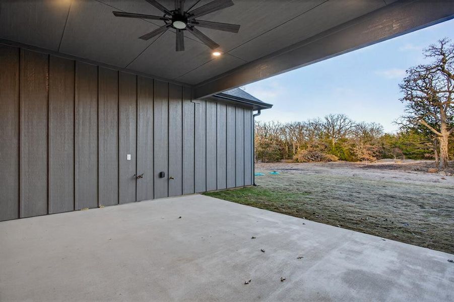 Wide open back patio with views of the many mature trees, which will be absolutely stunning this spring in bloom!