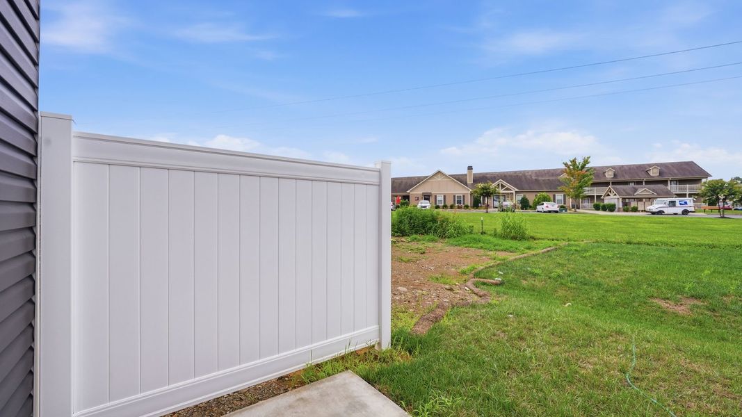 Exterior details and patio area of a home in The Arbor Townhomes, Kingsport (Image 19).