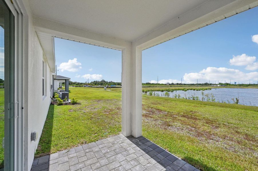 Front exterior of a new home in Hampton Park - Classic Series, Vero Beach, FL, highlighting curb appeal (Image 1).