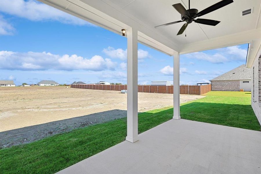 View of patio featuring ceiling fan