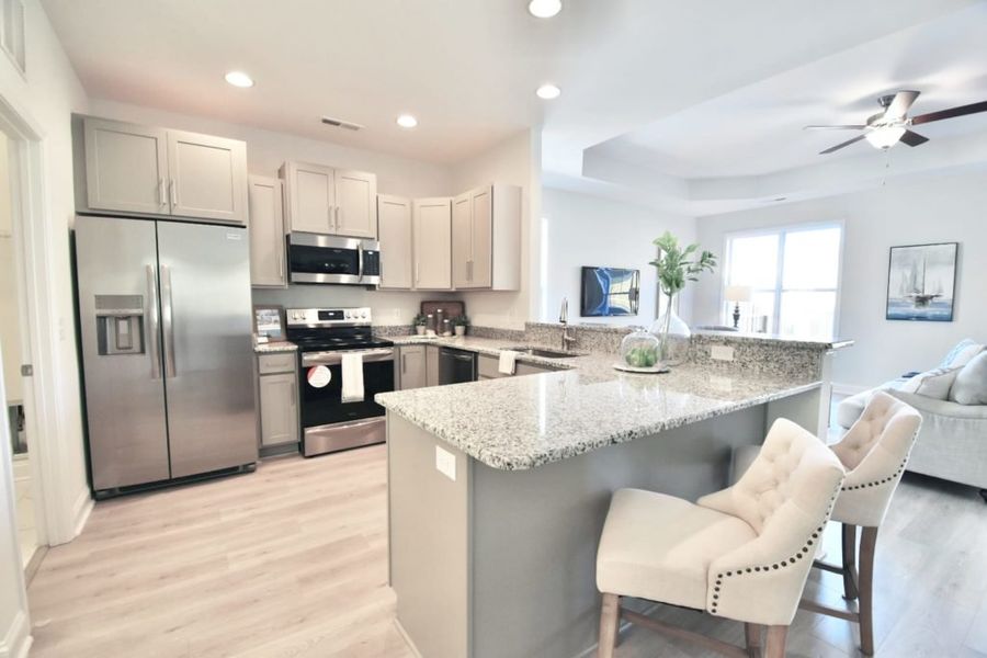 Furnished interior in a model home at Parkwood Estates in Leland (Image 40).