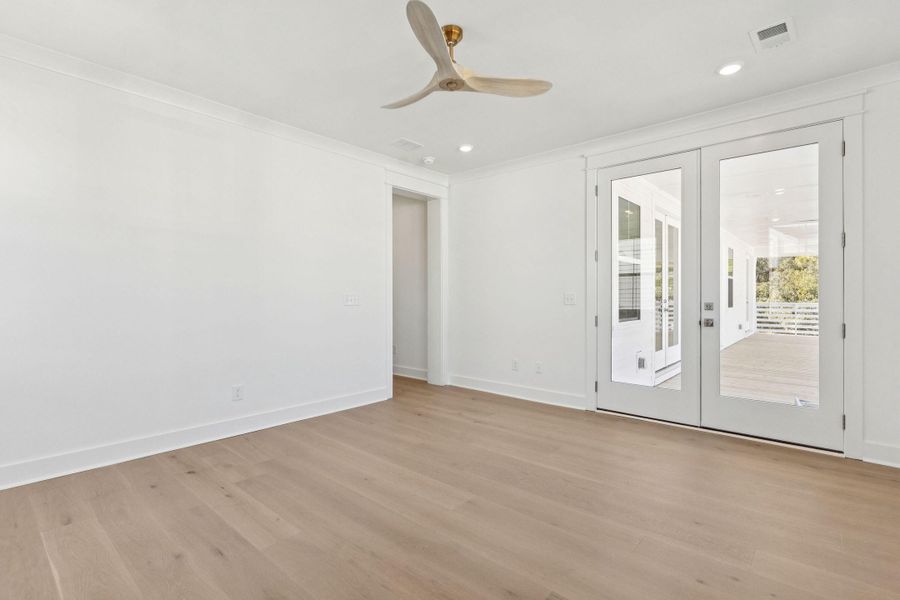 Spacious, unfurnished interior of a new home in Overlook at Copahee Sound, Awendaw (Image 61).