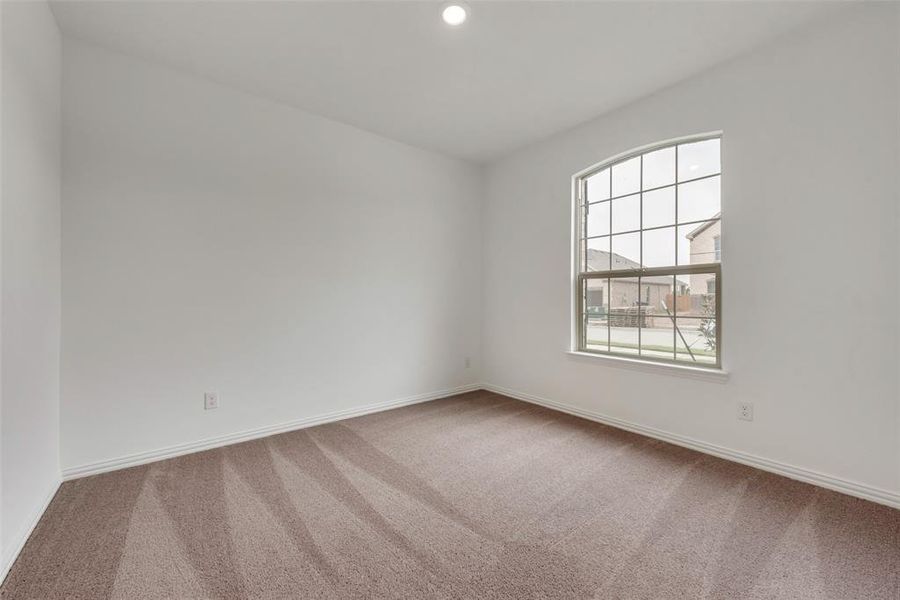 Empty room featuring carpet floors