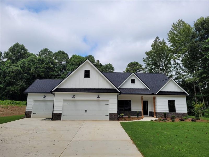 Front exterior of a new home in , Dallas, GA, highlighting curb appeal (Image 11).