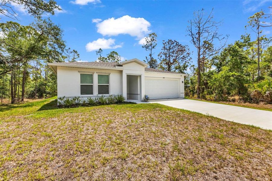 Front exterior of a new home in , Port Charlotte, FL, highlighting curb appeal (Image 17).